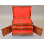2 wooden jewellery boxes both with similar ornate decorative brass hinging and detailing,