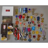 Good quantity of Soviet, British, French, American and German medals, coins and badges,