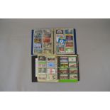Two albums containing assorted vintage phone cards,