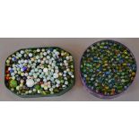 Two trays of assorted marbles, various sizes and ages.