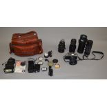Collection of assorted cameras and accessories including a Minolta XG2 and Tamron SP 70mm-210mm