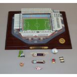 Villa Park Aston Villa FC model together with a number of badges.