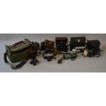 Collection of cameras and equipment including Canon AE-1 and Canon Super 8 together with two sets