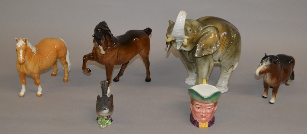 4 items of Beswick including a Toby Jug, bird,