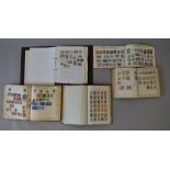 4 old stamp albums and a folder containing mostly European stamps,