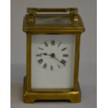 19th century brass carriage timepiece with french movement and key