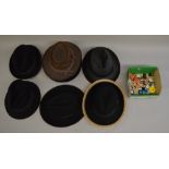 11 Assorted mens hats together with a quantity of buttons/badges/pins etc.