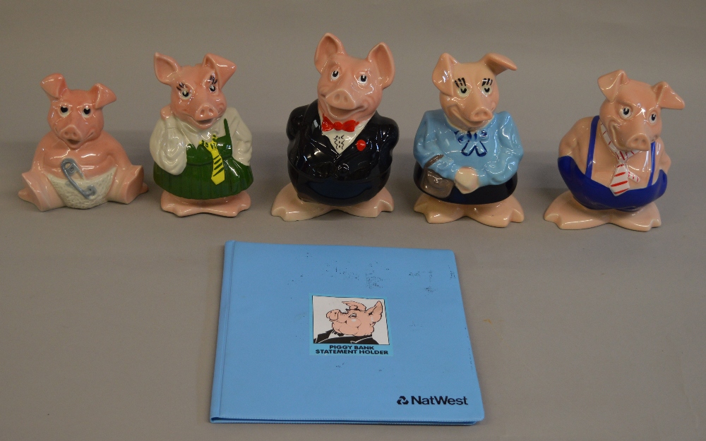 5 Natwest Pigs, all with original stoppers including a Statement Book.