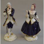 2 Royal Dux figures in period dress, male figure s/d to flute.