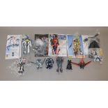 10 x built model kits by Hasegawa and similar, Macross and Valkyrie models, etc.