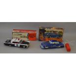 Japanese tinplate Lincoln police car together with a Welsotoys police car, both VG, boxed.
