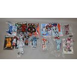 20 x Bandai Gundam/Mobile Suit built model kits, together with instructions.