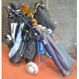 POLICE > 4 golf bags containing a good quantitty of golf clubs and accessories.