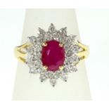 An 18ct H/M Ruby and Diamond cluster ring, approx total Diamond weight 1.