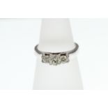 A 3-stone Diamond ring stamped 18k, approx total weight 0.