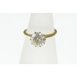 An 18ct H/M diamond solitaire ring, size L, approx 1.