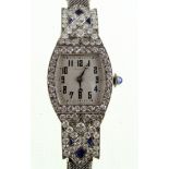A 1920's platinum, diamond and sapphire set cocktail watch with fitted 9ct white gold bracelet,