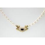 A ruby, sapphire and diamond set pearl necklet,