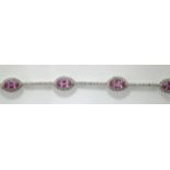 An 18ct H/M pink sapphire and diamond set bracelet, approx total diamond weight 1.
