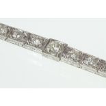 An Edwardian graduated old cut diamond panel line bracelet in a milgrain setting,