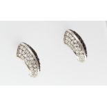 A pair of 18ct H/M black and white diamond set claw shaped earrings   [VAT included in hammer price