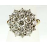 An 18ct H/M diamond cluster ring, the brilliant cut stones approx total weight 2.