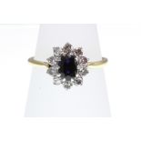 A Sapphire and Diamond cluster ring stamped 18ct,