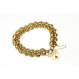 A Victorian fancy linked padlock bracelet stamped 15ct, approx 29.