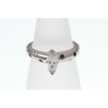 A marquise-cut Diamond solitaire ring set with Sapphire and Diamond shoulders,