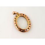 An oval picture locket marked 9ct set with 20 Opals,