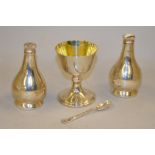 A silver plated three piece communion set with gilded chalice,