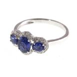 An 18ct H/M sapphire & diamond three stone cluster ring, approx sapphire weight 1.