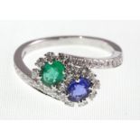 An 18ct H/M sapphire, emerald & diamond double cluster ring,
