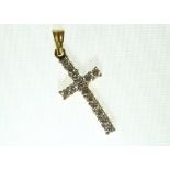 An 18ct H/M diamond set cross, approx total diamond weight 0.75ct, approx 2.