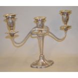 A silver two-branch candleabra with removeable sconces and fluted decoration, approx 9inch high,