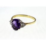 An 18ct H/M oval Amethyst & Diamond cluster ring, approx 4.