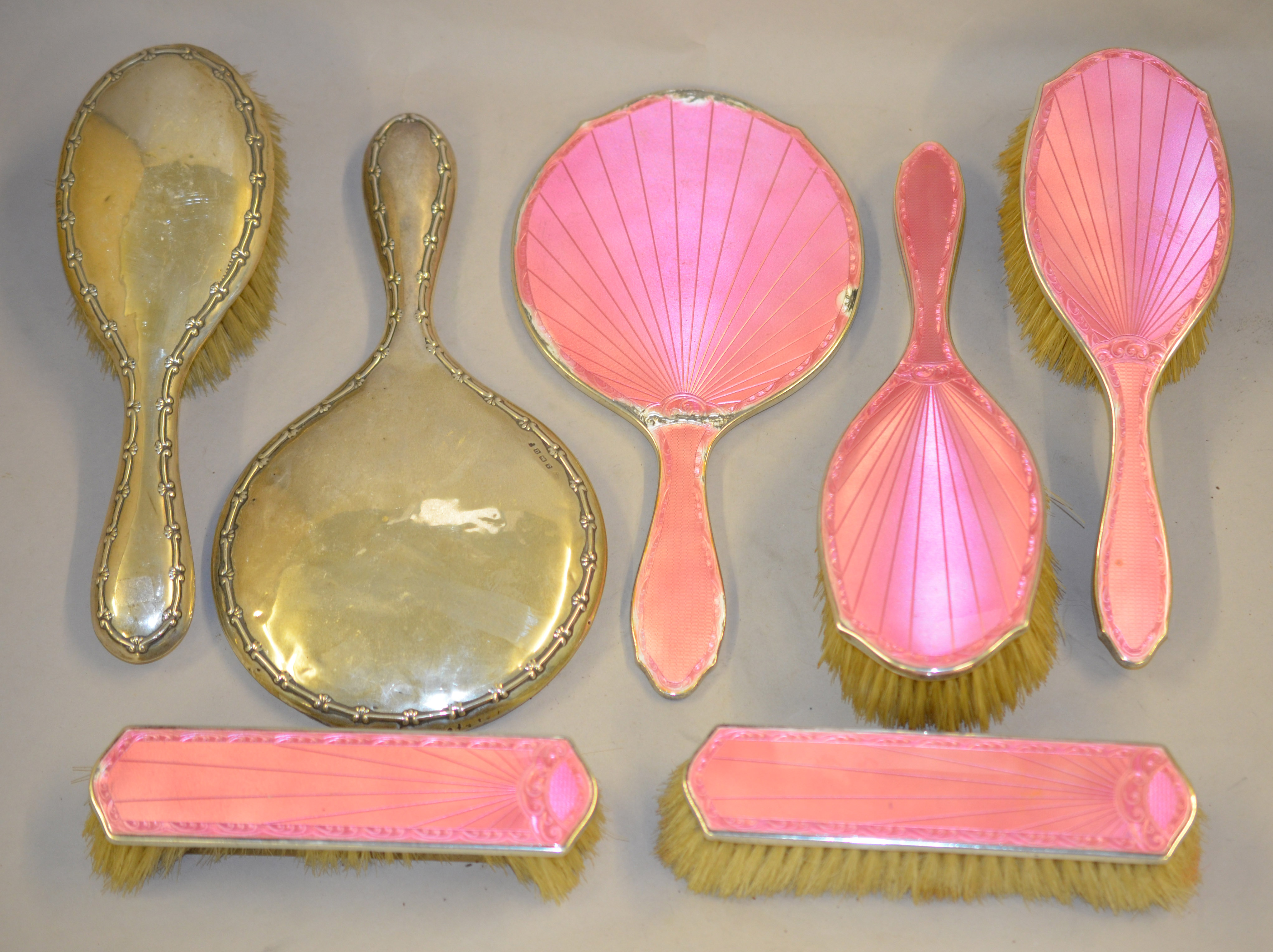 A quantity of silver backed hand mirrors and brushes,