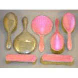 A quantity of silver backed hand mirrors and brushes,