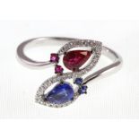 An 18ct H/M sapphire, ruby & diamond double cluster ring, ruby & sapphire approx weight 0.