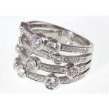 An 18ct H/M Boodles style four band diamond set ring, approx diamond weight 2.