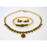 POLICE > A matching emerald set necklet, bangle and earring set,