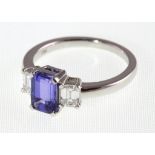 An 18ct H/M tanzanite & diamond three stone emerald cut ring, approx weights tanzanite 1.