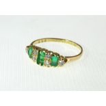 An 18ct Emerald & Diamond nine stone ring, H/M London 1913, approx 2.