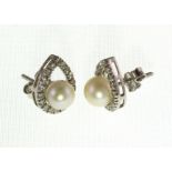 A pair of pearl & diamond ear studs