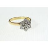 A 18ct H/M Diamond cluster ring totallin