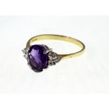 An 18ct H/M oval Amethyst & Diamond clus