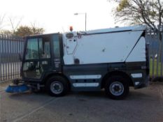 Schmidt Swingo compact road sweeper manufactured in 2006.