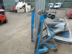 Genie manual winding cabled hoist c/w forks.