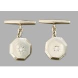 CUFF BUTTONS  Pair of octagonal cuff buttons of white gold, set in the middle with a diamond of