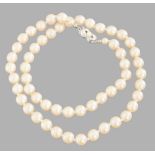 PEARL NECKLACE  String of pearls of creamy shade with sliding fastening made of silver set with a